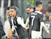  ?? REUTERS ?? ■
Cristiano Ronaldo (right) leaves on being replaced by Paulo Dybala during Juventus’ win over AC Milan in Turin on Sunday. Ronaldo was unhappy after being substitute­d for the second game in a row.