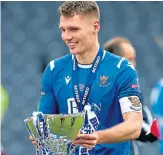  ??  ?? Jason Kerr with the Betfred Cup.