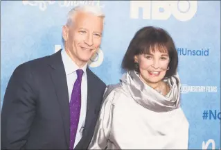  ?? Charles Sykes / Associated Press ?? CNN anchor Anderson Cooper and Gloria Vanderbilt attend the premiere of “Nothing Left Unsaid” at the Time Warner Center in New York on April 4, 2016. Vanderbilt, the “poor little rich girl” heiress at the center of a scandalous custody battle of the 1930s and the designer jeans queen of the 1970s and ’80s, died on Monday at 95, according to her son, Cooper.