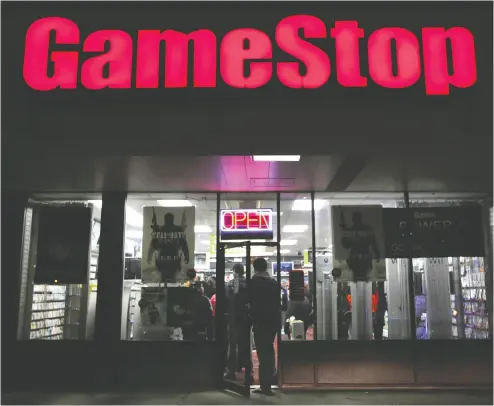  ?? SHANNON STAPLETON / reuters FILE ?? Video-game and collectibl­es purveyor Gamestop saw its stock drop 16 per cent to US$50.22 in Tuesday trading.