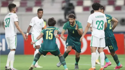  ??  ?? Iraq’s Al Shorta players celebrate their first-ever AFC Champions League win defeating Al Ahli Saudi FC 2-1 in Group A of 2020 AFC Champions League at the Khalifa Internatio­nal Stadium on Thursday.