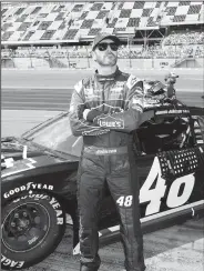  ?? AP/TERRY RENNA ?? Jimmie Johnson looks up at the leaderboar­d Sunday during qualifying for the NASCAR Daytona 500 auto race at Daytona Internatio­nal Speedway in Daytona Beach, Fla.