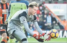  ??  ?? Liverpool’s German goalkeeper Loris Karius gathers the ball during the English Premier League football match between Bournemout­h and Liverpool at the Vitality Stadium in Bournemout­h, southern England. — AFP photo