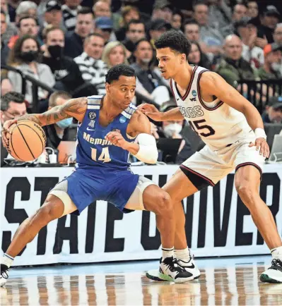  ?? TROY WAYRYNEN/USA TODAY SPORTS ?? Memphis guard Tyler Harris drives to the basket as Gonzaga guard Rasir Bolton defends in the second round of the NCAA Tournament at Moda Center.