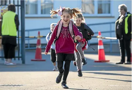  ?? JOE JOHNSON/STUFF ?? Christchur­ch East School student Alaynah White, 8, skips home at the end of her first day.