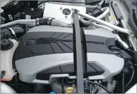  ??  ?? Under the hood of the Fisker Karma is a 2.0L, direct-injection, turbocharg­ed gasoline engine which acts as a generator.