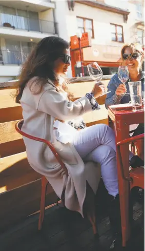  ??  ?? Barbara Yamanaka (from left), Carolyn Nobel and Margaux Nobel dine at China LiLive on Broadway in S.F. in July after the restaurant added outside dining so it could continue serving diners.