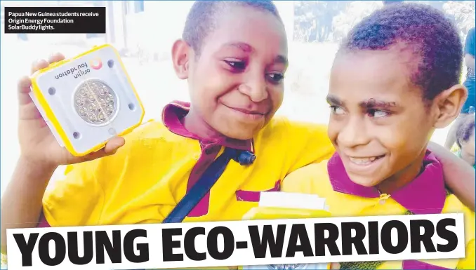  ??  ?? Papua New Guinea students receive Origin Energy Foundation Solarbuddy lights.
