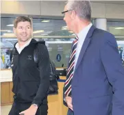  ??  ?? FLYING START Graham Dorrans and director of football Mark Allen get ready to board plane and, right, boss Gerrard