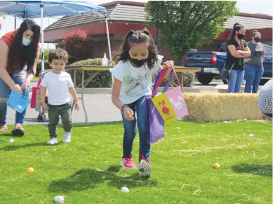  ?? Jeff Larson/appeal-democrat ?? Andrea, 6, finds an egg during the Yuba-sutter Marketplac­e’s sponsored Easter Egg Hunt on Saturday in Yuba City.