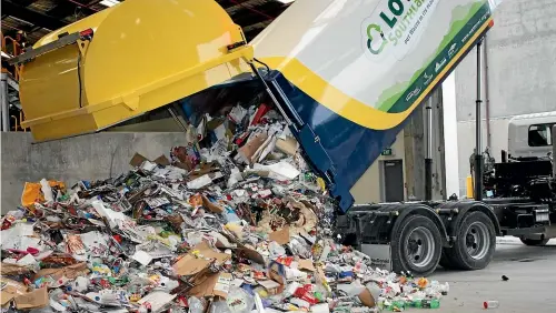  ??  ?? Recycling collection vehicle emptying into the load bay at the Invercargi­ll recycling facility. PHOTO: SUPPLIED.