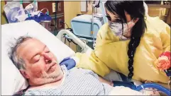  ??  ?? Sara Estela, of New Britain, at the bedside of her father, Juan Estela at Middlesex Hospital after her wedding ceremony.