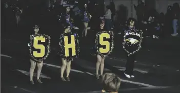  ?? SHARON BURNS PHOTO ?? Southwest High School students present the Marching Eagles Drill Team and Cheer squad during the Mardi Gras Parade 2023, Saturday, February 18, in El Centro.