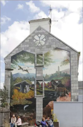  ??  ?? The mural at the Plaza in Charlevill­e, painted by local artist Peter O’Brien, is one of the more recent additions to the town which have come courtesy of the local Tidy Towns committee. (file photo)