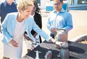  ?? NATHAN DENETTE/THE CANADIAN PRESS ?? Campaignin­g in Oakville, Liberal Leader Kathleen Wynne said an NDP government would be risky.