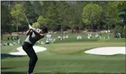  ?? GREGORY BULL — THE ASSOCIATED PRESS ?? Rory McIlroy tees off on the fourth hole during a practice round on Wednesday in Augusta, Ga.