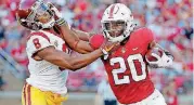  ?? [AP PHOTO] ?? Stanford running back Bryce Love, right, suffered an undisclose­d injury against USC last week and will not play Saturday against UC Davis.