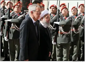  ?? AP/RONALD ZAK ?? Austrian President Alexander Van der Bellen (left) and Iranian President Hassan Rouhani review a color guard Wednesday in Vienna during a welcoming ceremony for Rouhani. The Iranian leader was on the second leg of a two-day tour of Austria and Switzerlan­d, the two neutral countries where the now-imperiled Iran nuclear agreement was negotiated in 2015.