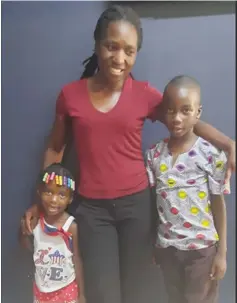  ?? ?? Ms Mary Paruwani with her kids Nyasha Chandiwana (son) and Rutendo Chandiwana