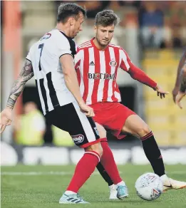  ??  ?? Sunderland midfielder Ethan Robson fights for the ball at Grimsby.