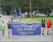  ??  ?? Above and below, people celebrate the 100th anniversar­y of the Sherrill American Legion with a parade down East Seneca Street in Sherrill on Saturday.