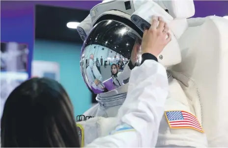  ?? Chris Whiteoak / The National ?? Innovation­s such as those in this space suit at the Gitex exhibition in Dubai have applicatio­ns on Earth