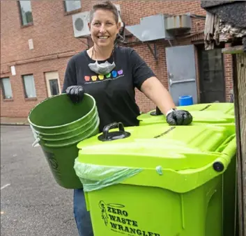  ?? Pam Panchak/ Post- Gazette ?? Sherree Goldstein, owner of the Square Cafe in Braddock, has a policy to recycle and compost all food scraps and paper items from the restaurant, as seen here Thursday.