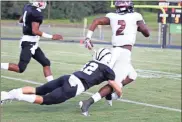  ?? / Contribute­d by Shelly Culver ?? Paine Culver drags down a Heard County runner during the first quarter.