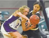  ?? John Leyba, The Denver Post ?? Pueblo South’s Jada Dupree, right, knocks the ball away from Mesa Ridge’s Chloe Welch during their teams’ Class 4A semifinal game Thursday at the Denver Coliseum.