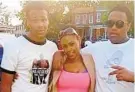  ?? ROYSTER FAMILY/BALTIMORE SUN ?? In 2015, Devin Rogers, left, posed for a photograph with his mother, Angela Royster, and his younger brother, Dennis Royster. Devin Rogers was fatally shot in north Baltimore on Aug. 7. He was 23.