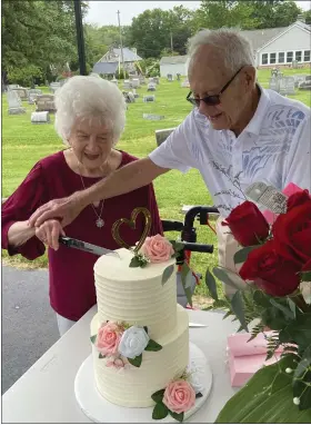  ?? EVAN BRANDT — MEDIANEWS GROUP ?? Martha and Chester Pish, cut a cake from Beverly’s Pastry Shop during a celebratio­n of their 80th wedding anniversar­y, making them the oldest married couple in Pennsylvan­ia.
