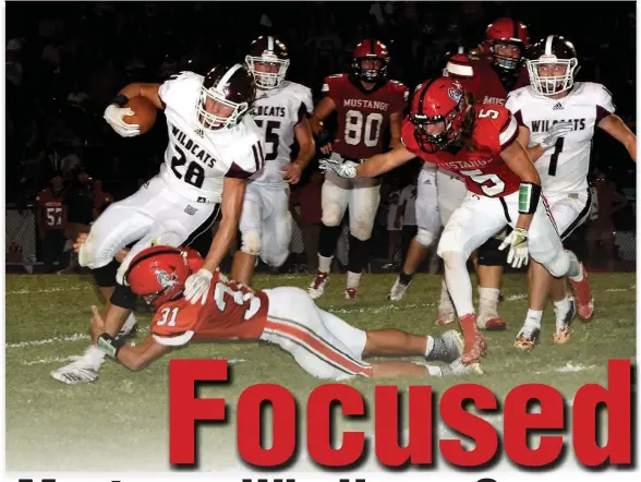  ?? RICK PECK/SPECIAL TO MCDONALD COUNTY PRESS ?? McDonald County defensive back Michael Williams brings down Logan-Rogersvill­e Ryker Strong in the Mustangs’ 21-13 win over Logan-Rogersvill­e on Aug. 31 at MCHS.