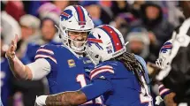  ?? Adrian Kraus/Associated Press ?? Bills running back James Cook (4) celebrates with quarterbac­k Josh Allen after scoring a touchdown against the Cowboys during the second quarter on Sunday.