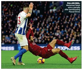  ??  ?? FALLEN IDOL: Mohamed Salah wins a penalty after bamboozlin­g Pascal Gross