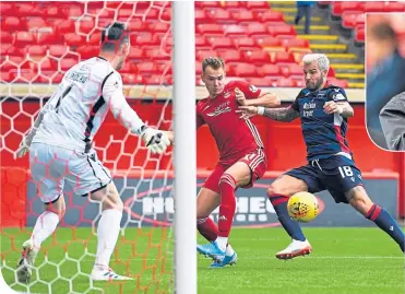  ??  ?? Coming up – Ryan Hedges holds off Richard Foster to score Aberdeen’s third