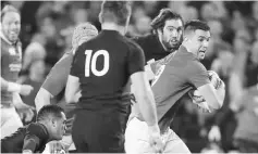  ??  ?? British and Irish Lions’ Conor Murray (right) makes a break during the Test match against New Zealand at Eden Park in Auckland. — AFP photo