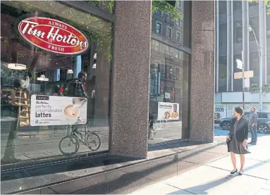  ?? DOUG IVES THE CANADIAN PRESS ?? Sales at Tim Hortons in Canada open for 13 months or more jumped 0.9 per cent in the quarter ending Sept. 30.