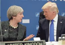  ?? MATT DUNHAM, AP ?? President Trump speaks with British Prime Minister Theresa May during a working dinner meeting at the NATO headquarte­rs during a summit in Brussels on Thursday. Trump and European leaders won’t always see eye to eye.