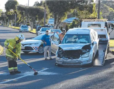  ?? Photo: Michael Nolan ?? SUBURBAN CRASH: Queensland Ambulance Service paramedics transporte­d a woman to the Toowoomba Hospital after her car was hit by a motorist on Thursday.