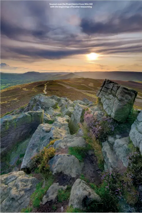 ??  ?? Ssunset over the Peak District from Win Hill with the beginnings of heather blossoming
May 2021