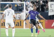  ?? PHOTO BY RAUL ROMERO JR. ?? The Galaxy’s Sega Coulibaly, back, vies for the ball against the Earthquake­s’ Jeremy Ebobisse, who scored in the match.