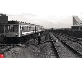  ??  ?? 3. A historic shot on May 31, 1993, as DMU No. 117420 (with the BLS' ‘Thames & Chiltern Rambler II' tour) forms the last through passenger train to cross the flyover. The unit has just passed Flyover Junction and is on the line to Fenny Stratford; Bletchley station is on the right.