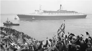  ??  ?? Clockwise from top, the interior of the Queen’s Room on the QE2; the cruise ship is launched from Clydebank in Scotland, where it was made, 50 years ago; patriotic crowds see off the QE2 on its maiden voyage from Southampto­n to New York on May 2, 1969;...