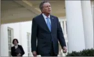  ?? EVAN VUCCI — THE ASSOCIATED PRESS FILE ?? Ohio Gov. John Kasich walks out of the White House in Washington. The House GOP health care bill has competitio­n from other Republican­s, a group of governors who’ve made their own proposal about how to overhaul Medicaid for low-income people. They’re...