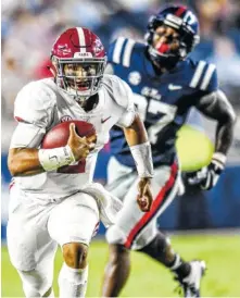  ?? AP PHOTO/BRUCE NEWMAN ?? Alabama quarterbac­k Jalen Hurts runs with Ole Miss defensive end Qaadir Sheppard in pursuit during their Sept. 15 game in Oxford, Miss. Hurts has not started this season after doing so the first 28 games of his collegiate career, but he has appeared in all four contests.
