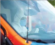  ?? CALIFORNIA­N FILE PHOTO ?? In this file photo, a Hall Ambulance detailer cleans the steering wheel as part of a stringent decontamin­ation process.