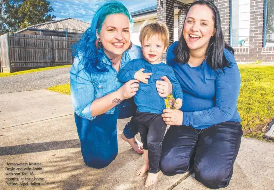  ??  ?? Homeowners Kristina Doyle and wife Annie with son Ted, 16 months, at their home. Picture: Nigel Hallett