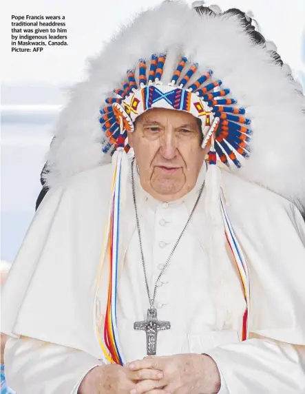  ?? Picture: AFP ?? Pope Francis wears a traditiona­l headdress that was given to him by indigenous leaders in Maskwacis, Canada.