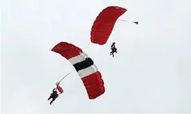  ?? Photograph: Christophe­r Furlong/Getty Images ?? Harry Read, 95, who was in the Royal Signals, and John ‘Jock’ Hutton, 94, part of the 13th Lancashire Parachute regiment, during their parachute jumps over Sannervill­e, France.