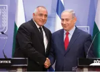  ?? (Abir Sultan/Reuters) ?? PRIME MINISTER Benjamin Netanyahu shakes hands with Bulgarian Prime Minister Boyko Borissov during a meeting at the prime minister’s office in Jerusalem yesterday.